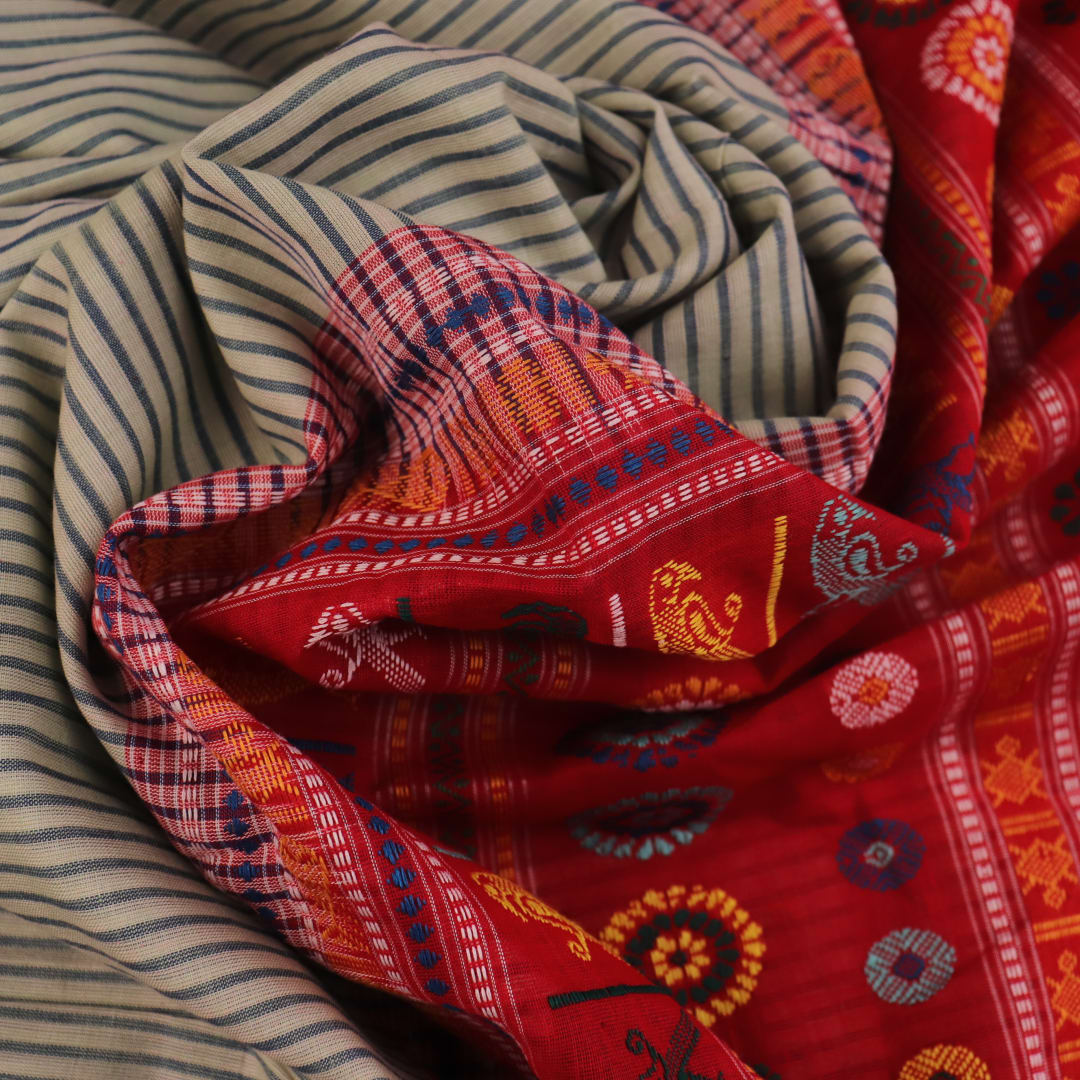 Full length view of a handloom grey and red striped Dolabedi cotton saree.