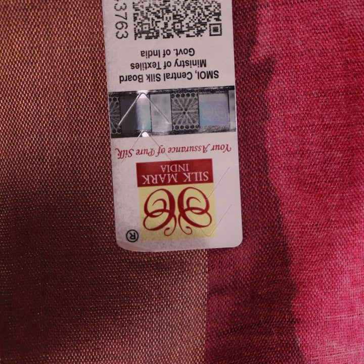 Close-up of maroon Tussar silk saree fabric, emphasizing its distinct texture and printed pattern.