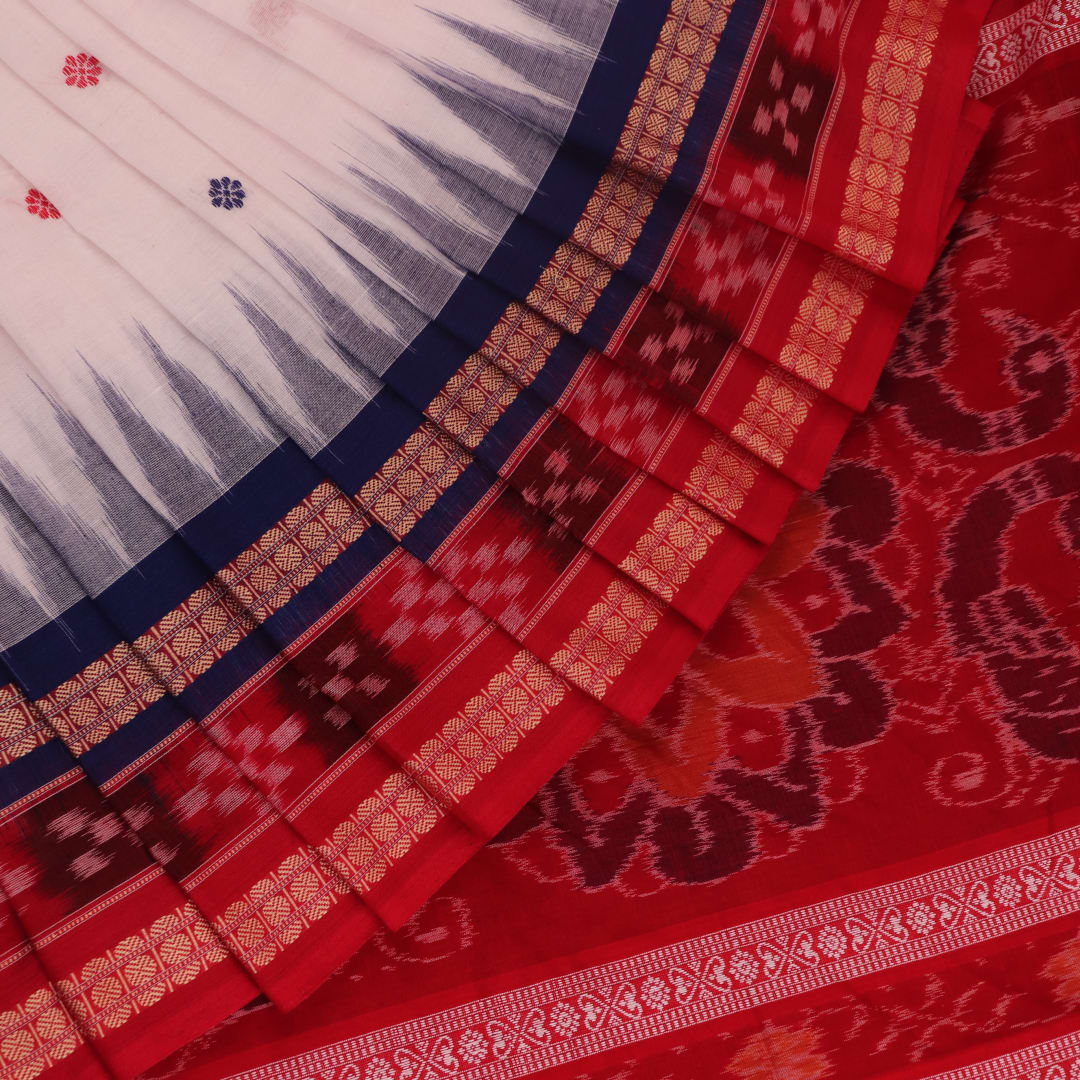 Full view of a white and red Sambalpuri cotton saree with butta pattern.