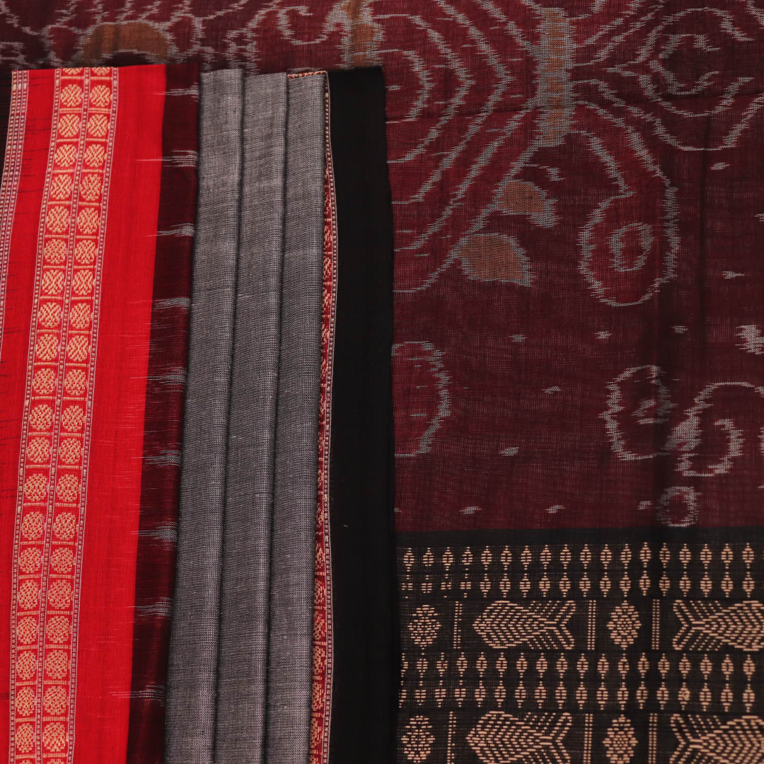 Full view of grey Bomkai cotton saree, featuring black border and butta pattern.
