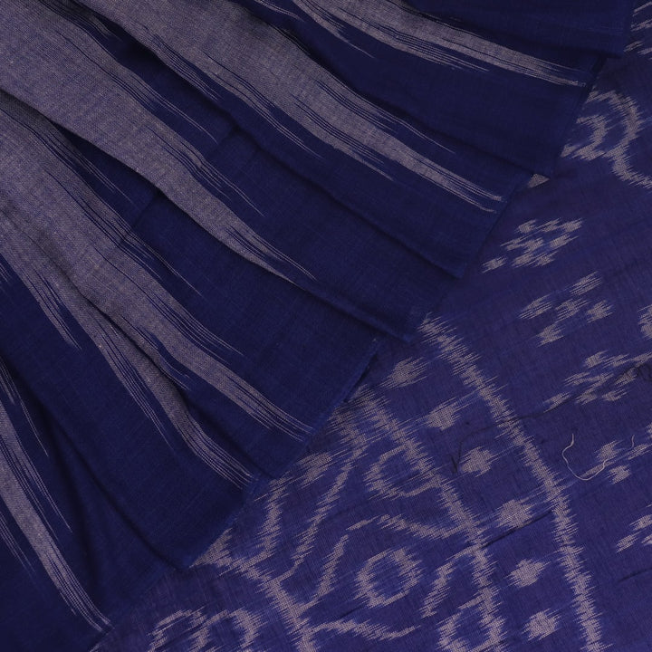Blue plain Sambalpuri cotton saree styled, highlighting its simple elegance and drape.