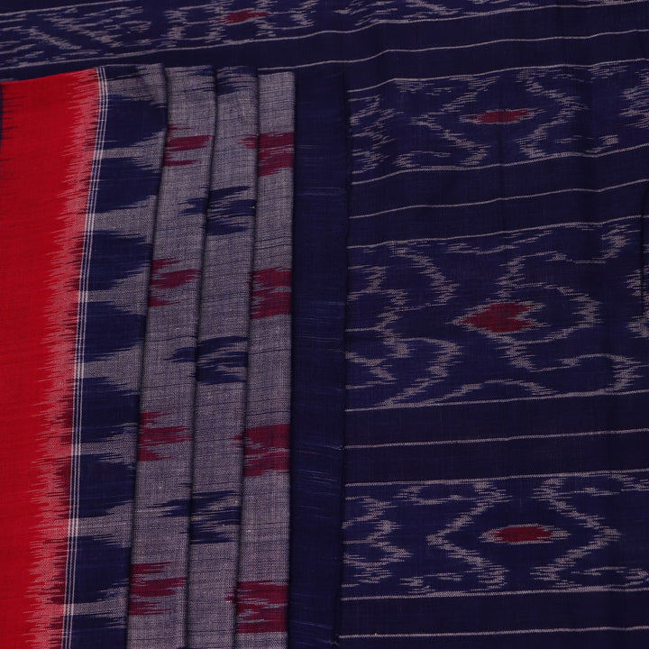 Blue Sambalpuri cotton saree with motifs, gracefully draped.
