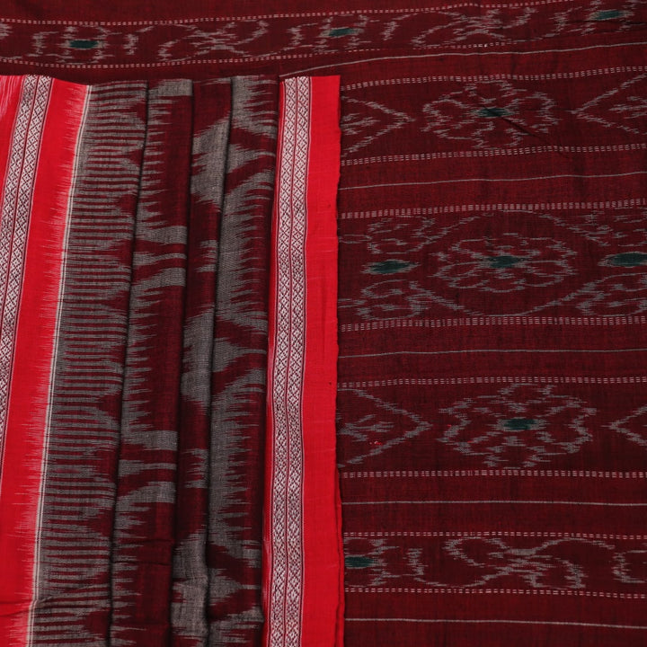 Grey and red Sambalpuri cotton saree draped to show its fall, style, and motif pattern.