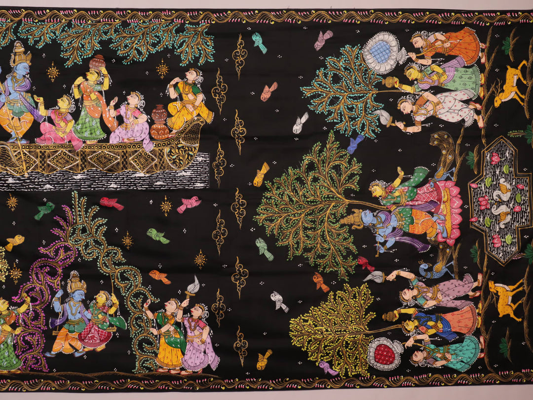 Close-up of black silk Patachitra saree fabric, showcasing hand-painted texture and detail.