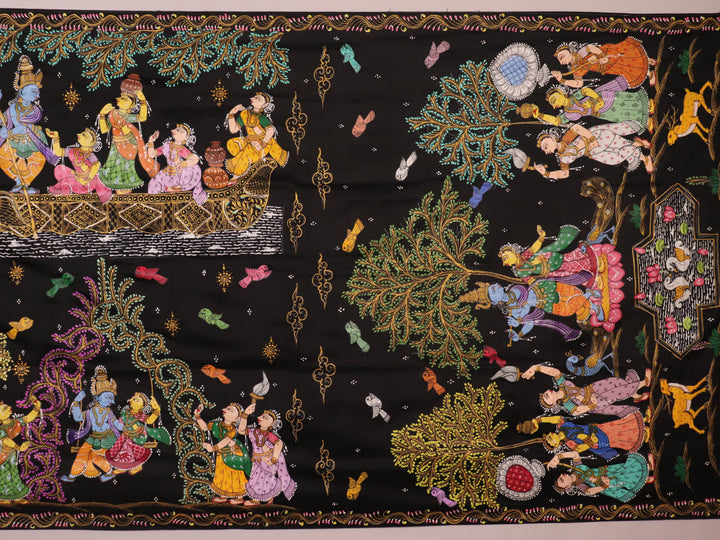 Close-up of black silk Patachitra saree fabric, showcasing hand-painted texture and detail.