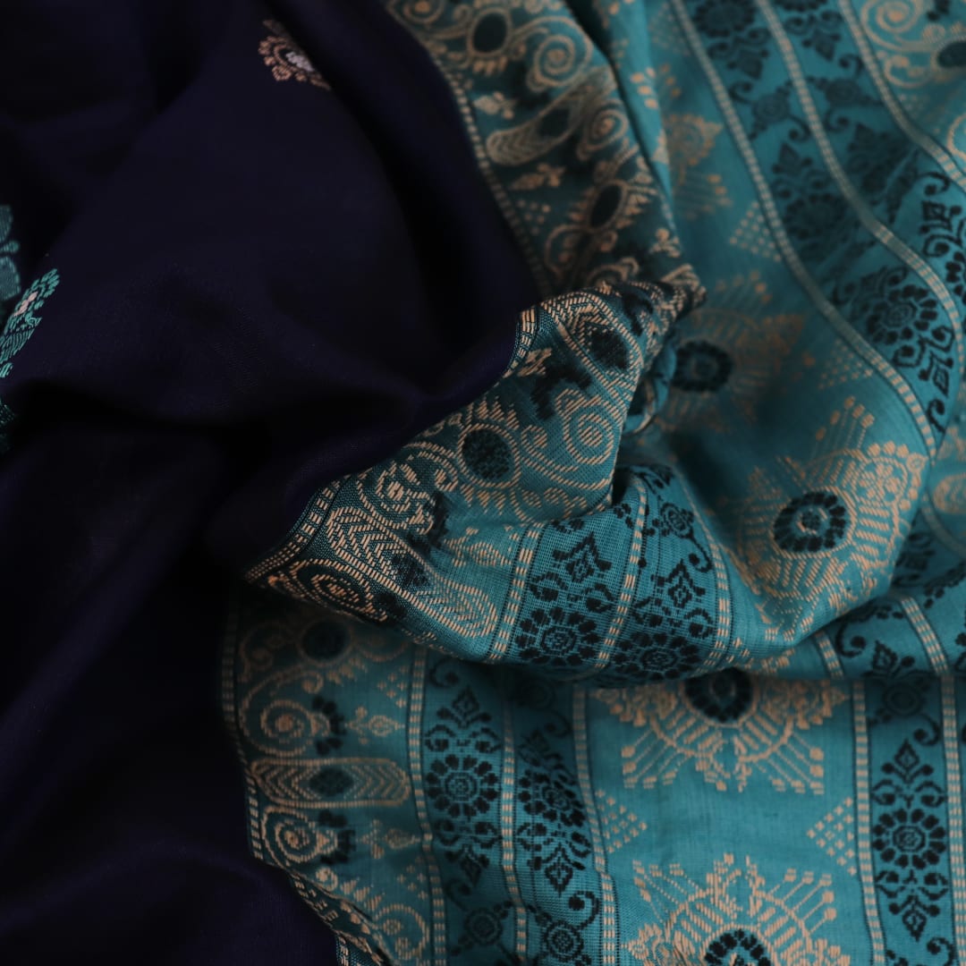 Full length view of a blue and green Bomkai Cotton Saree with Butta pattern.