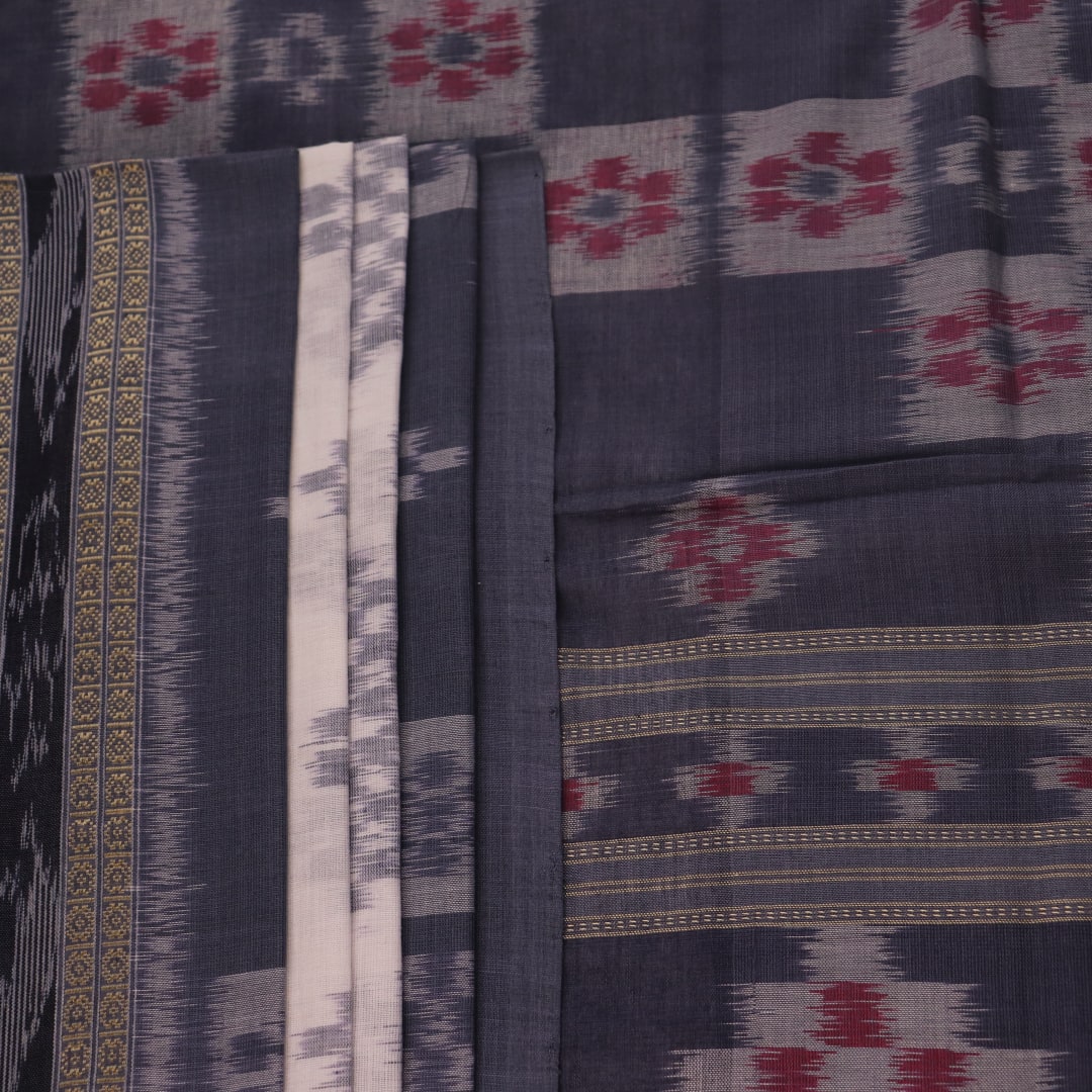 Draped view of white and grey Sambalpuri cotton saree with motifs.