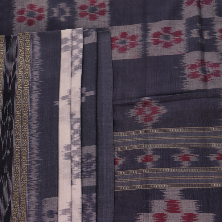 Draped view of white and grey Sambalpuri cotton saree with motifs.