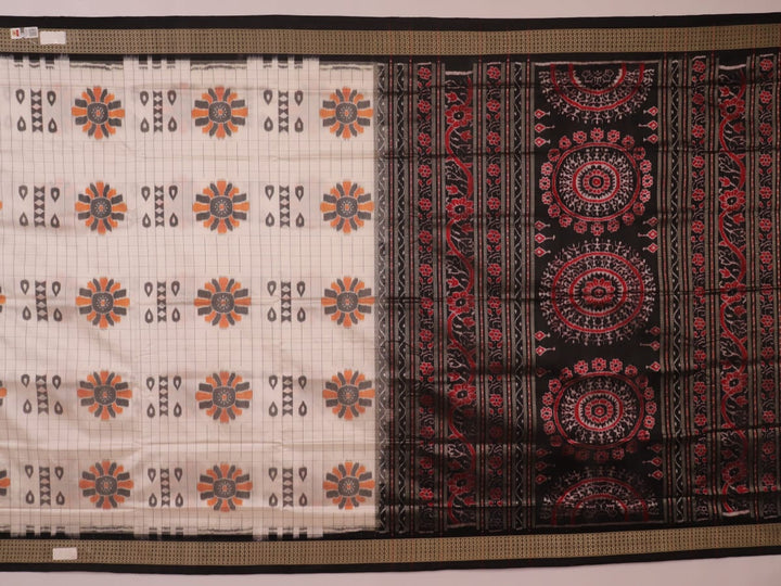 Close-up of handloom Sambalpuri silk saree fabric texture; white with subtle black motifs.