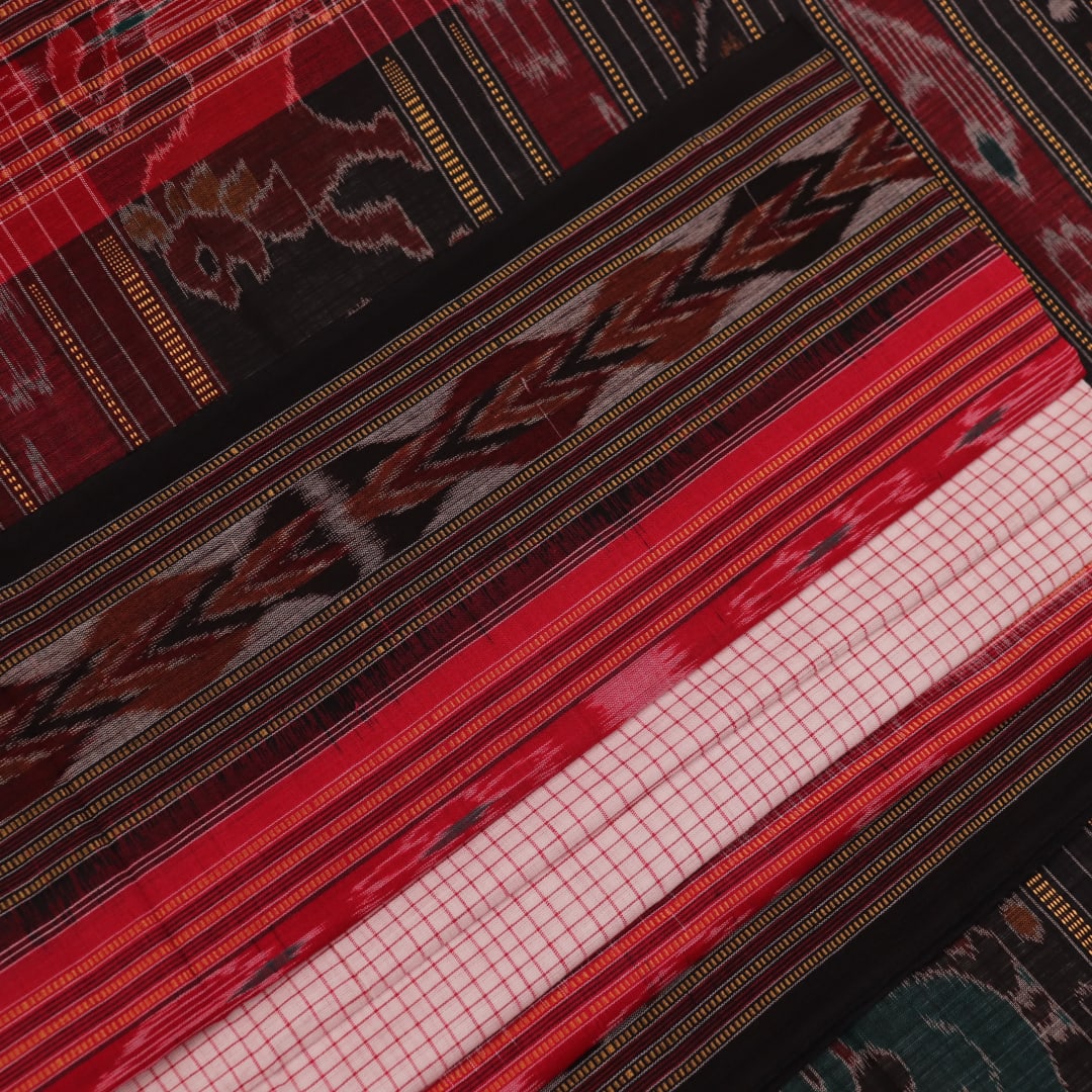 Saree styling: White and black Sambalpuri cotton saree with motifs, draped to showcase the overall look.