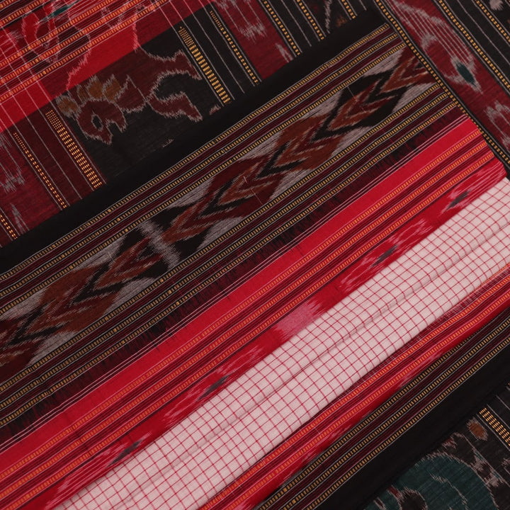 Saree styling: White and black Sambalpuri cotton saree with motifs, draped to showcase the overall look.