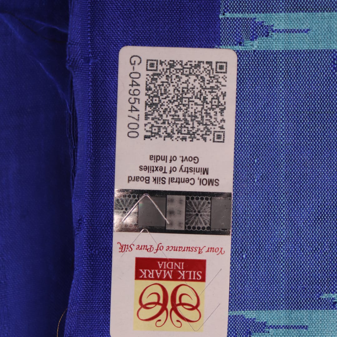 Close-up of plain blue Sambalpuri silk handloom saree fabric texture.