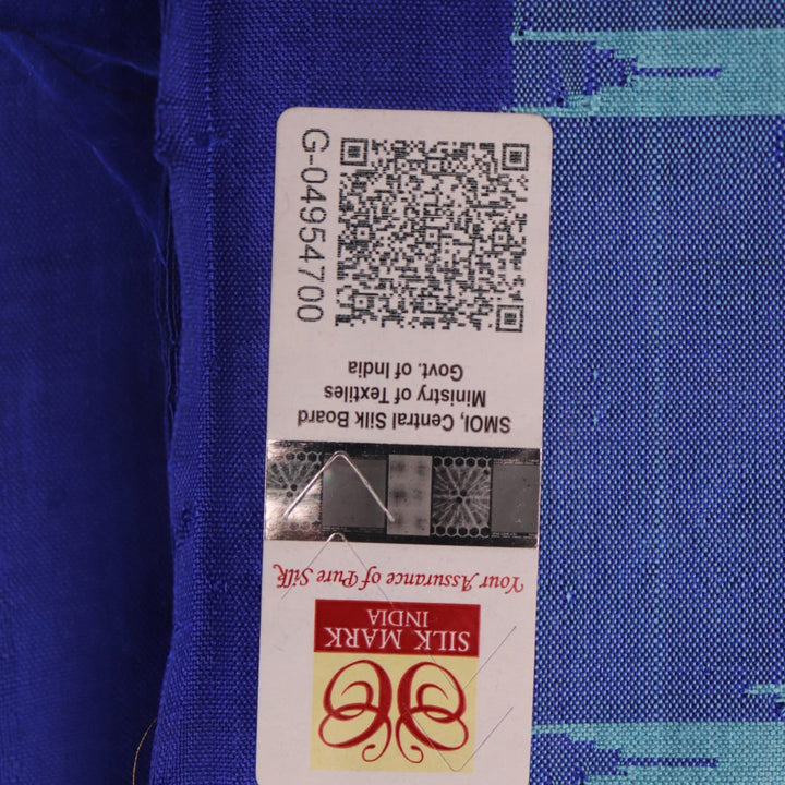 Close-up of plain blue Sambalpuri silk handloom saree fabric texture.