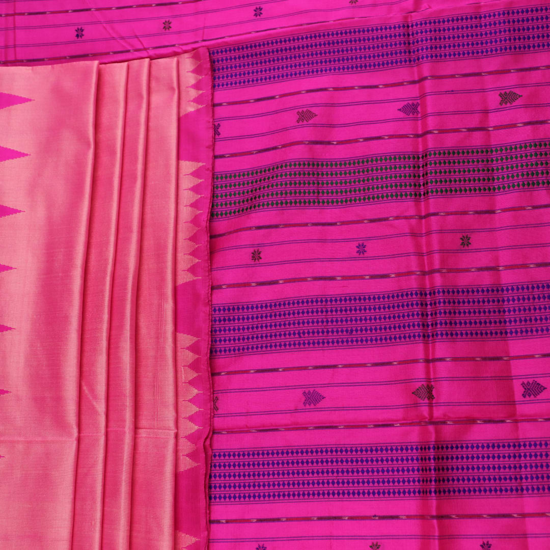 Close-up of plain peach and pink Sambalpuri silk saree fabric texture.