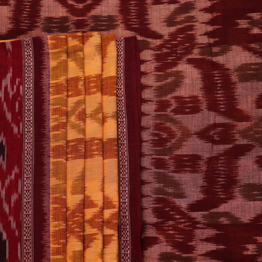 Yellow and maroon Sambalpuri cotton saree with motifs, draped elegantly to showcase its design.