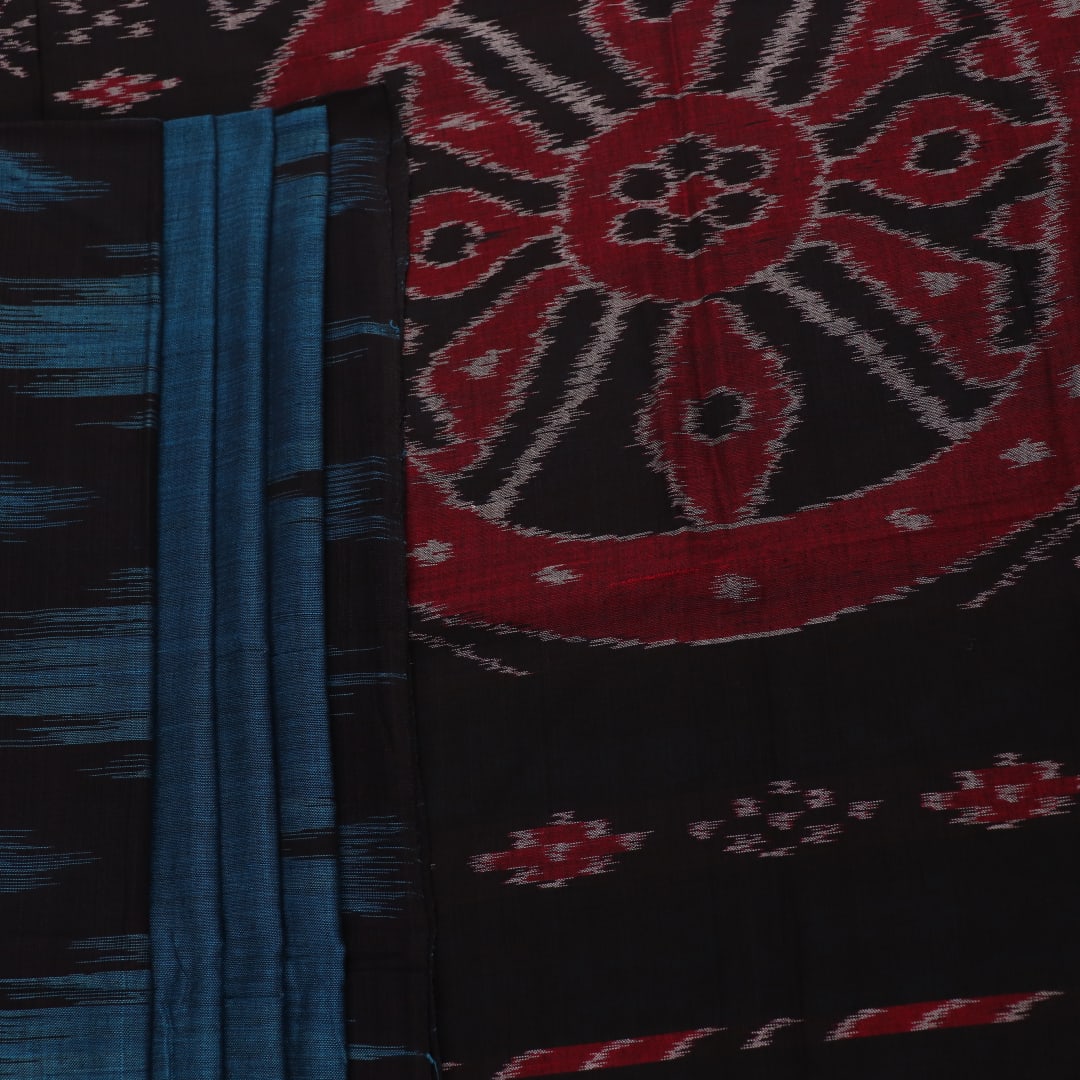 Draped plain blue and black Sambalpuri cotton saree.