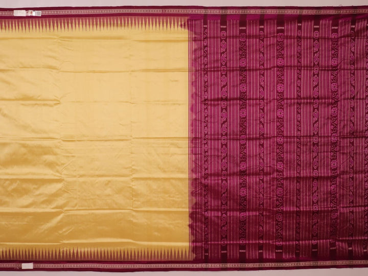 Close-up of plain cream and magenta Sambalpuri Silk Saree fabric texture.