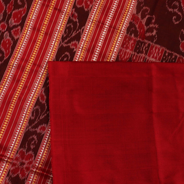 Close-up of plain green Sambalpuri silk saree fabric texture.