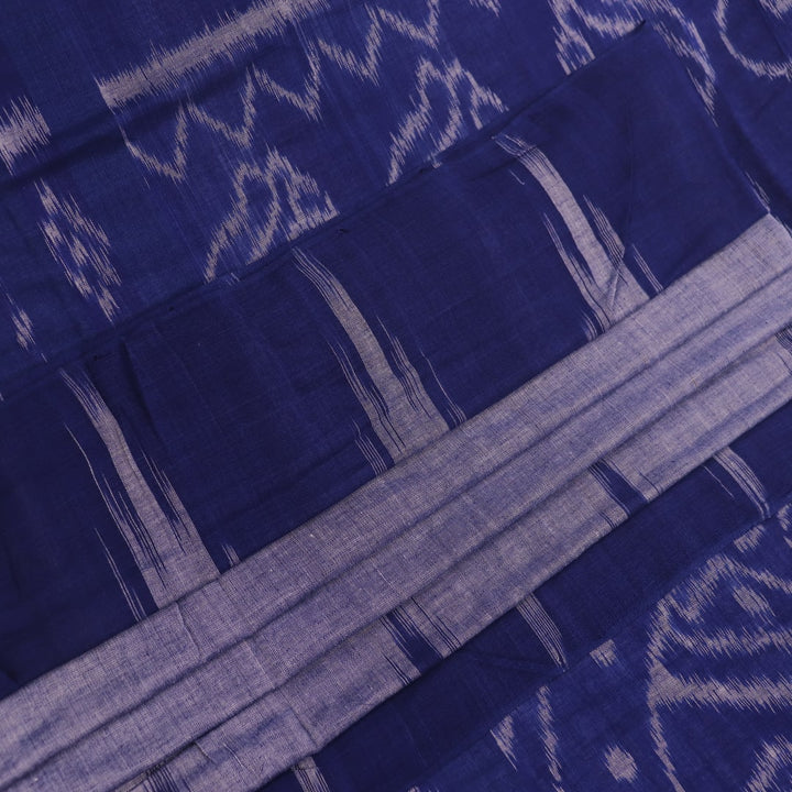 Blue plain Sambalpuri cotton saree styled, highlighting its simple elegance and drape.