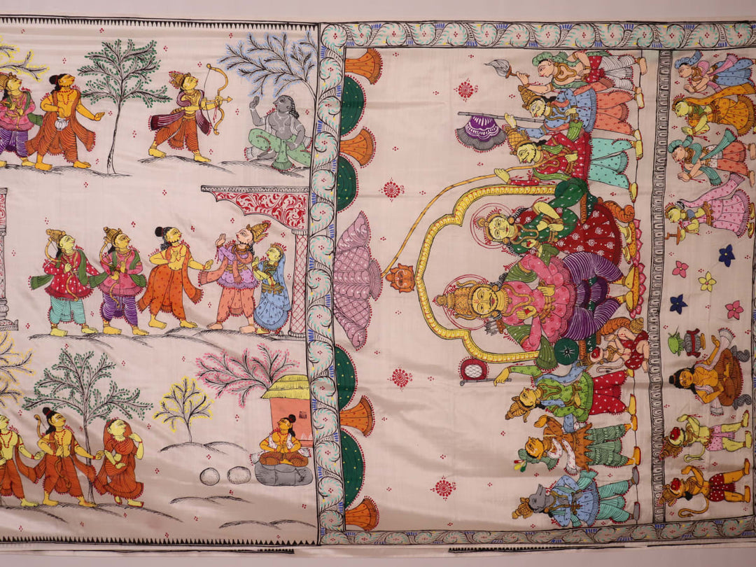 Close-up of handloom white silk Patachitra saree fabric showing texture and hand-painted details.