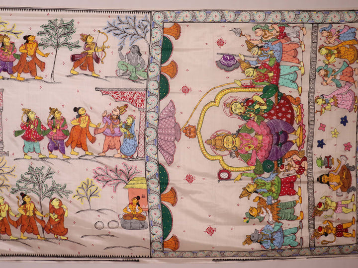 Close-up of handloom white silk Patachitra saree fabric showing texture and hand-painted details.