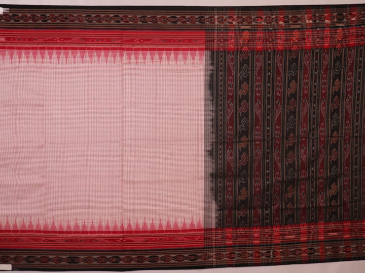 Woman draped in a white and black Sambalpuri cotton saree with motifs.