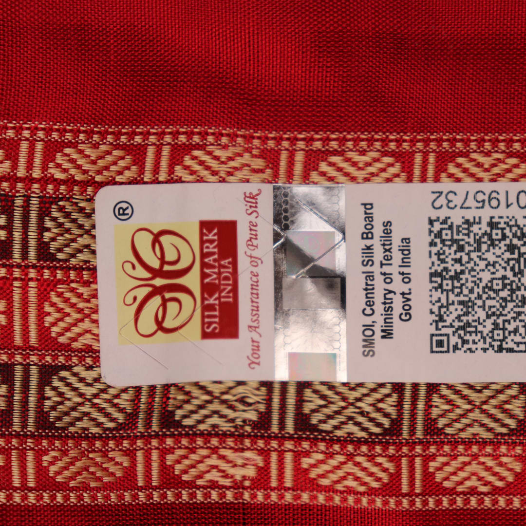 Close-up of black and red striped Sambalpuri silk saree's woven texture.