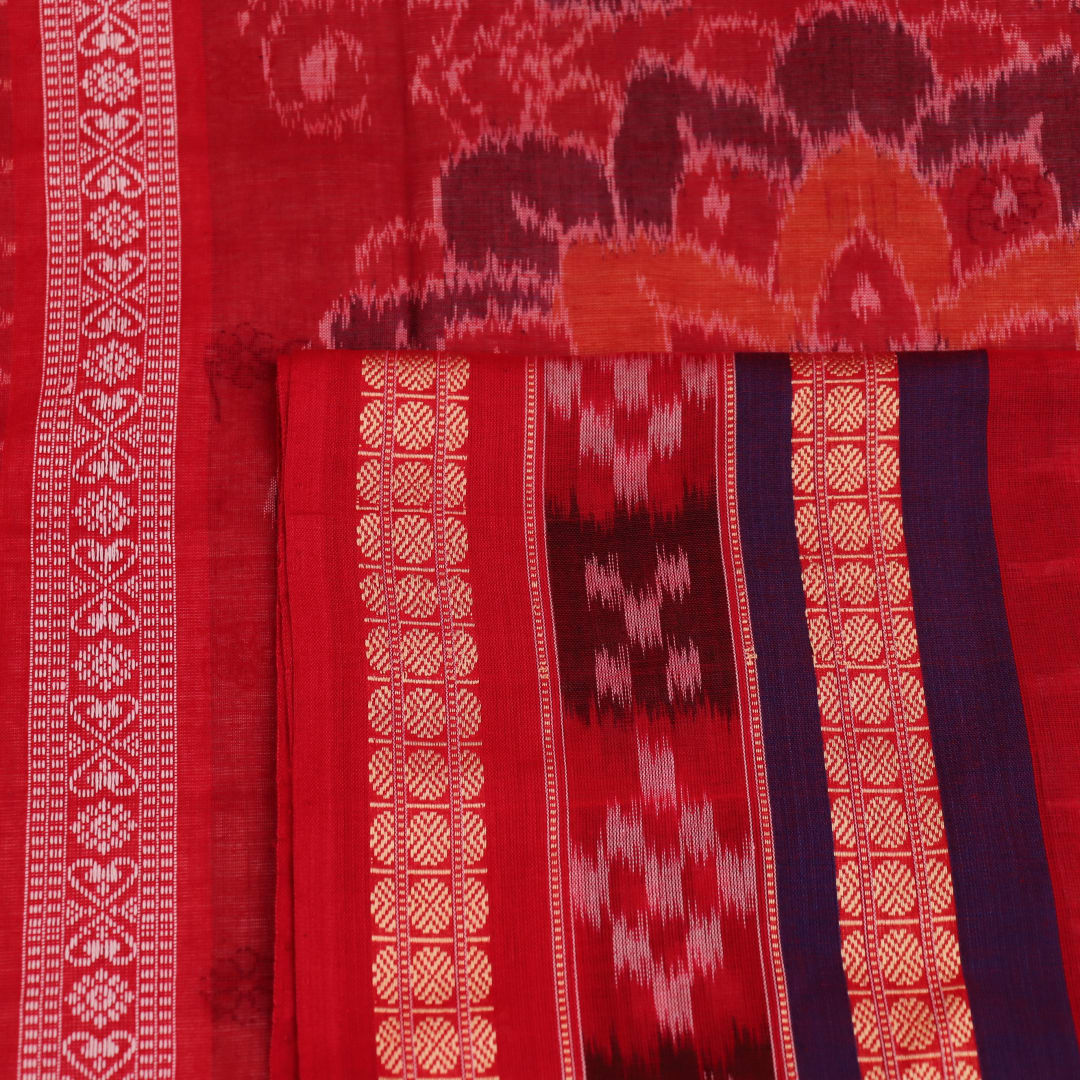 Full view of a white and red Sambalpuri cotton saree with butta pattern.
