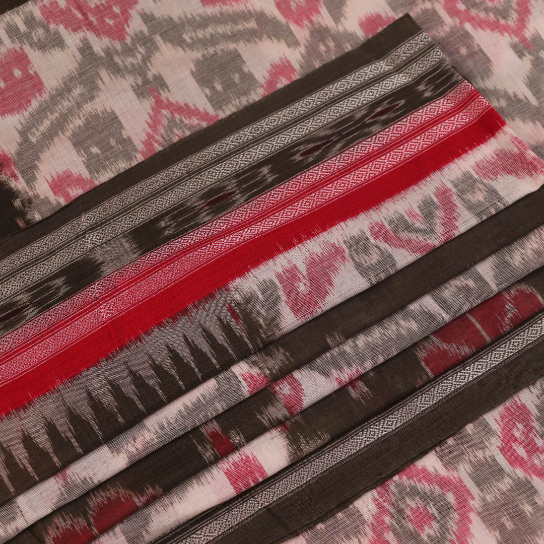 Off-white Sambalpuri cotton saree with green motifs, elegantly draped.