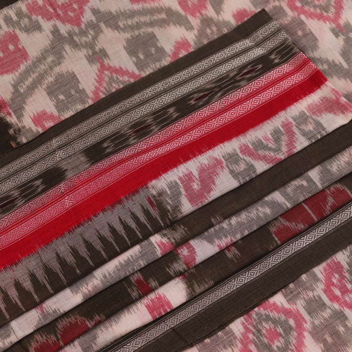 Off-white Sambalpuri cotton saree with green motifs, elegantly draped.