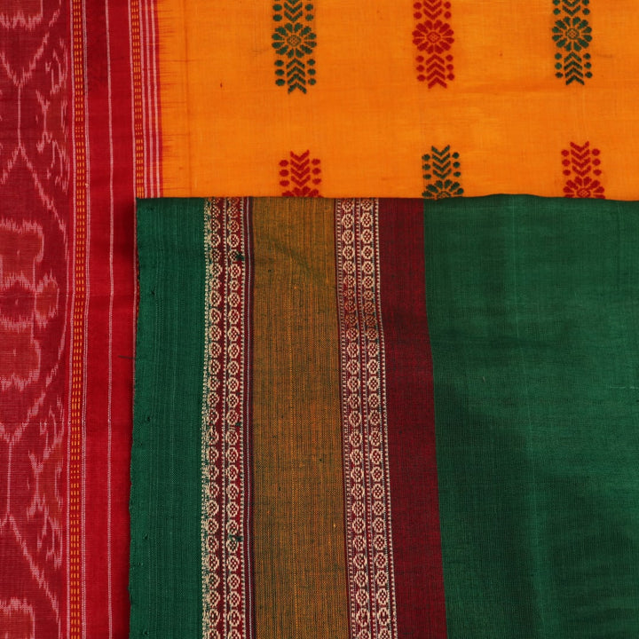 Full view of a white and green cotton handloom Bomkai saree with butta pattern.
