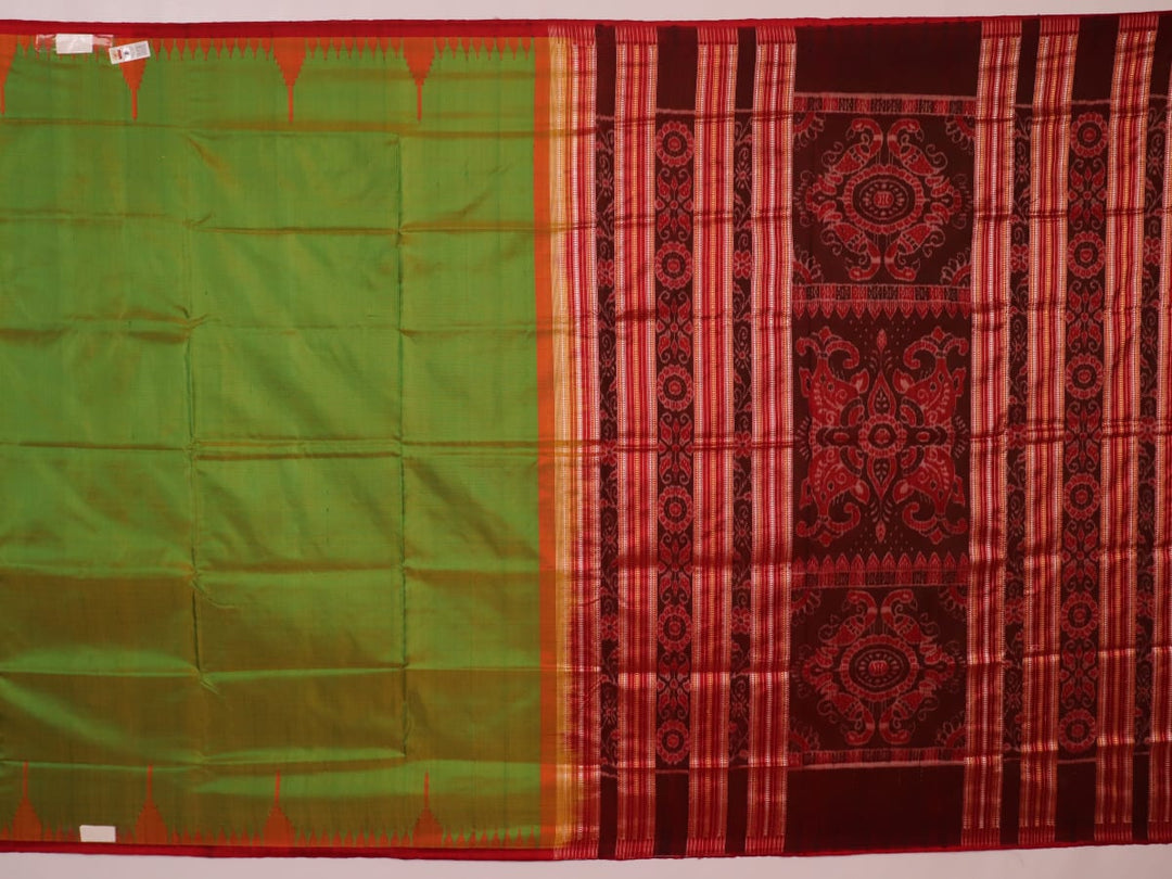 Close-up of plain green Sambalpuri silk saree fabric texture.