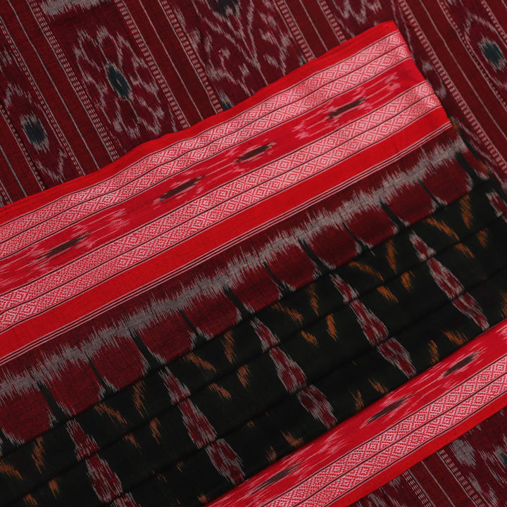 Black and red Sambalpuri cotton saree draped, showcasing its traditional motifs and elegant handloom texture.
