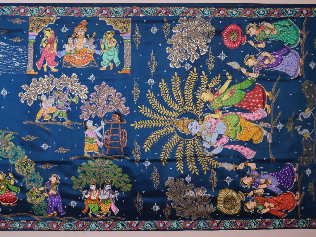 Close-up of the handwoven blue Patachitra silk saree, showcasing the detailed texture of the fabric.