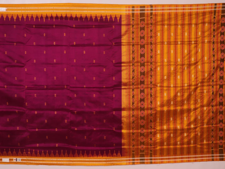 Close-up fabric texture of a magenta Sambalpuri Silk Saree with yellow butta pattern.