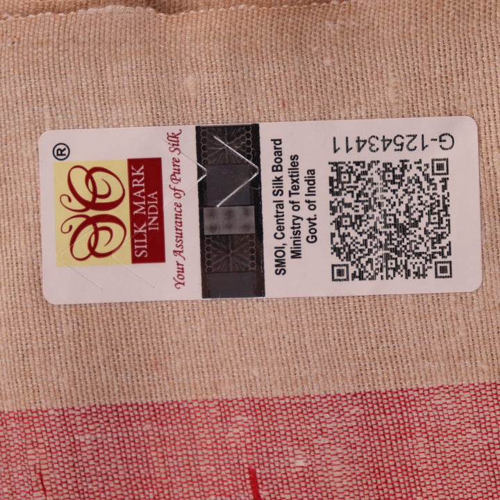 Close-up of plain red and off-white Tussar silk saree fabric texture.