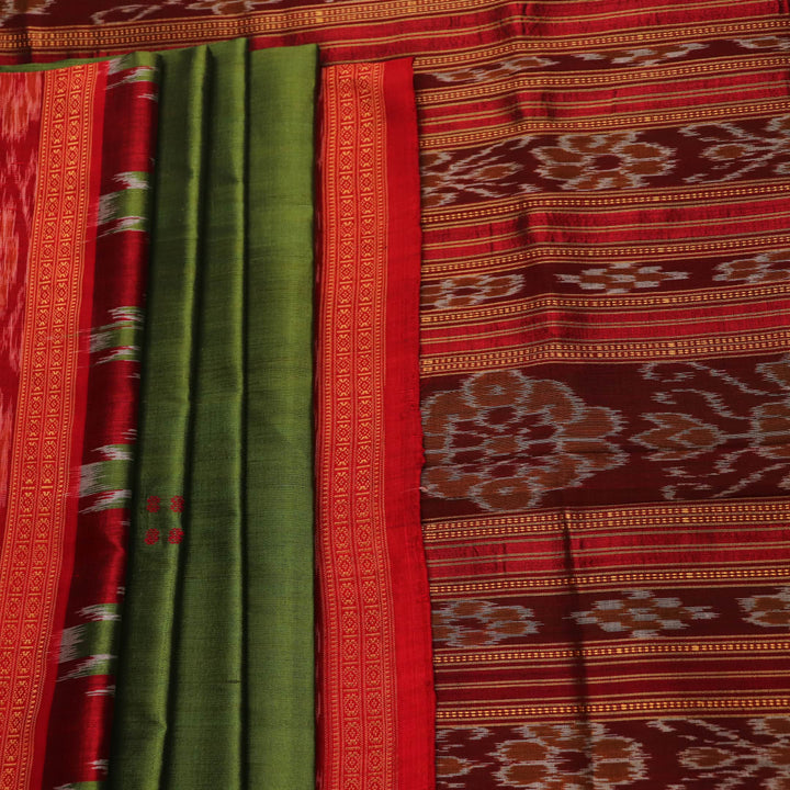Green Khandua silk saree draped, showcasing its butta pattern and red accents.