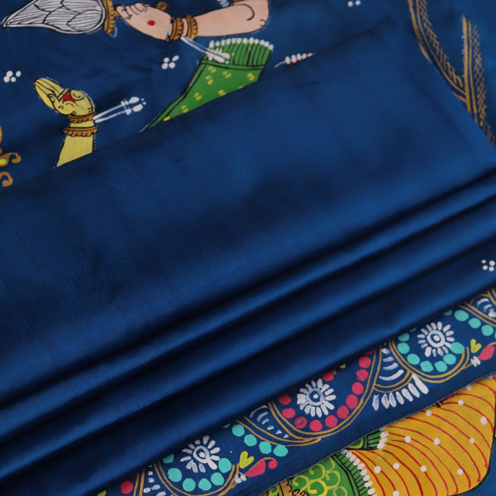Close-up of the handwoven blue Patachitra silk saree, showcasing the detailed texture of the fabric.