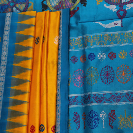 Close-up of the yellow Bomkai silk saree fabric texture, revealing its intricate weave and butta pattern.