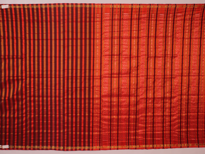 Close-up of multi-color striped Sambalpuri Silk Saree fabric texture.