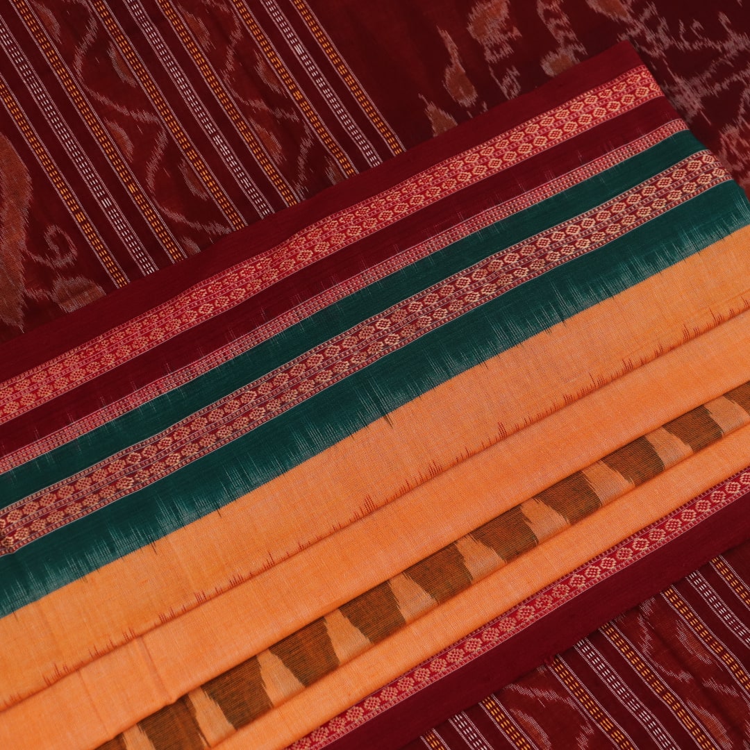 Full view of a yellow and maroon Bomkai cotton saree with butta pattern.