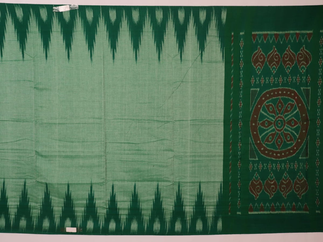 Model wearing a plain green Sambalpuri cotton saree, elegantly draped.