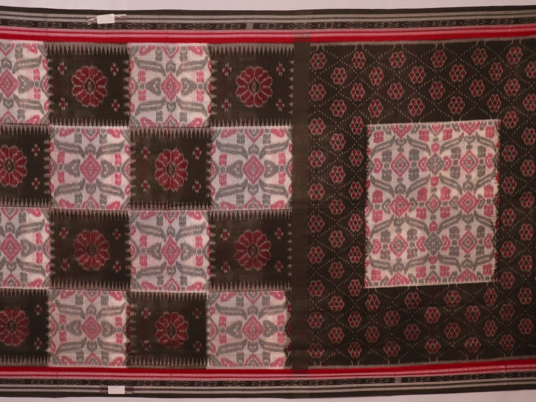 Off-white Sambalpuri cotton saree with green motifs, elegantly draped.