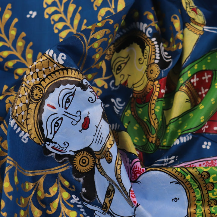 Close-up of the handwoven blue Patachitra silk saree, showcasing the detailed texture of the fabric.