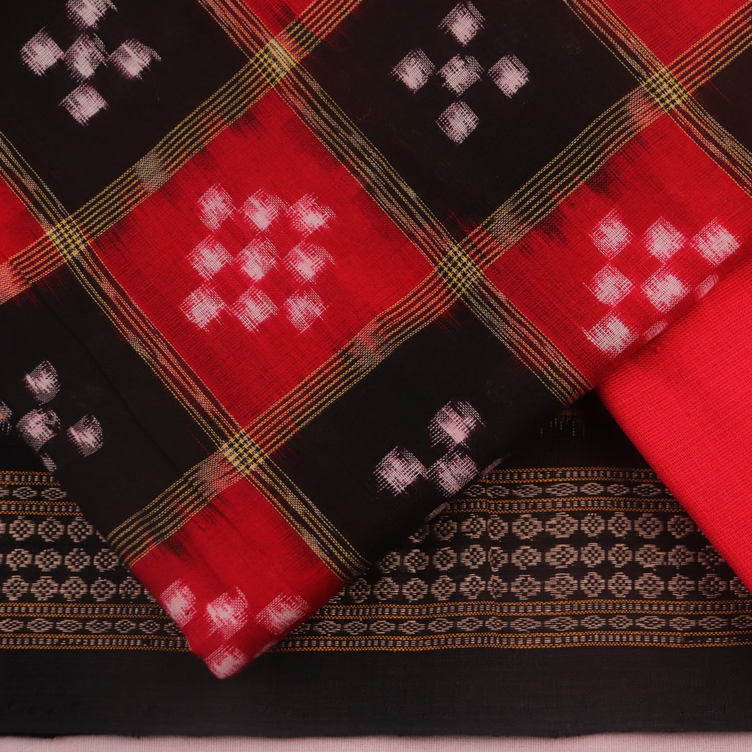 Detail of the black Sambalpuri cotton Pasapalli dress material's blouse piece with red accents.