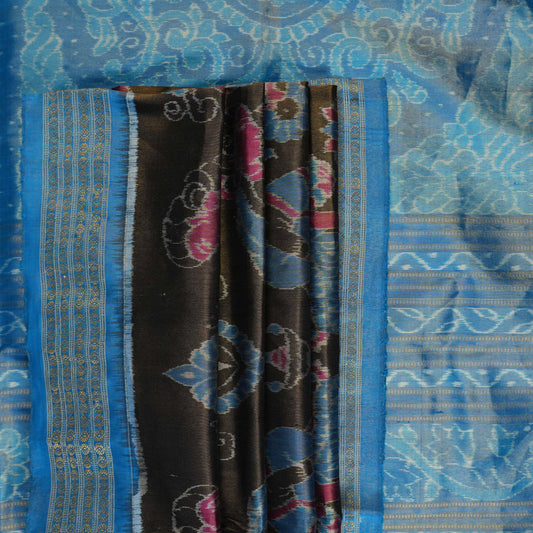 Close-up of Sambalpuri silk saree fabric, revealing rich blue multi-color weave texture and tissue motifs.