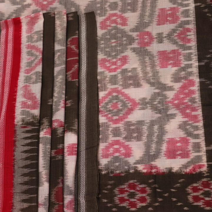 Off-white Sambalpuri cotton saree with green motifs, elegantly draped.