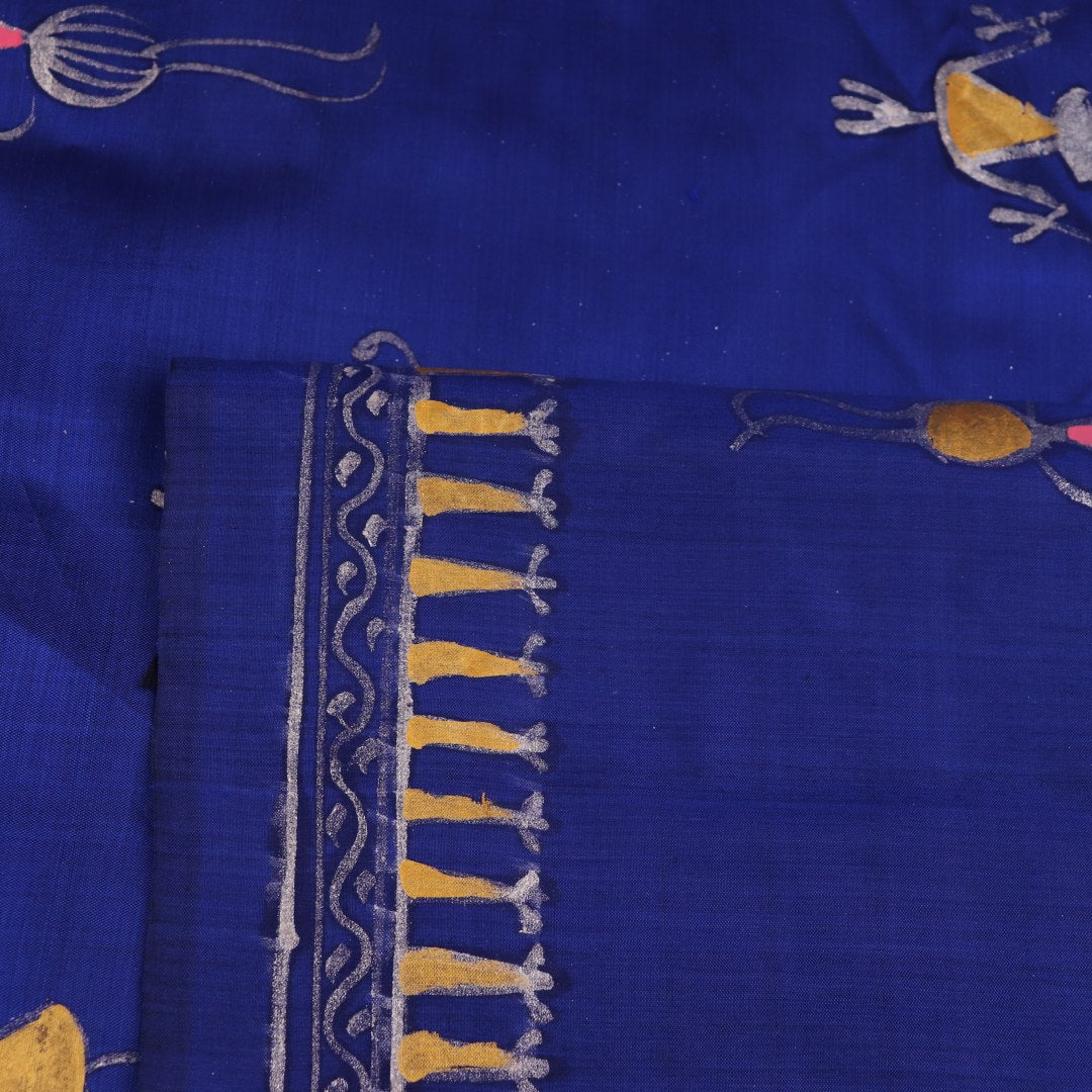 Close-up of handloom blue silk Patachitra saree, showcasing the detailed texture of the hand-painted fabric.