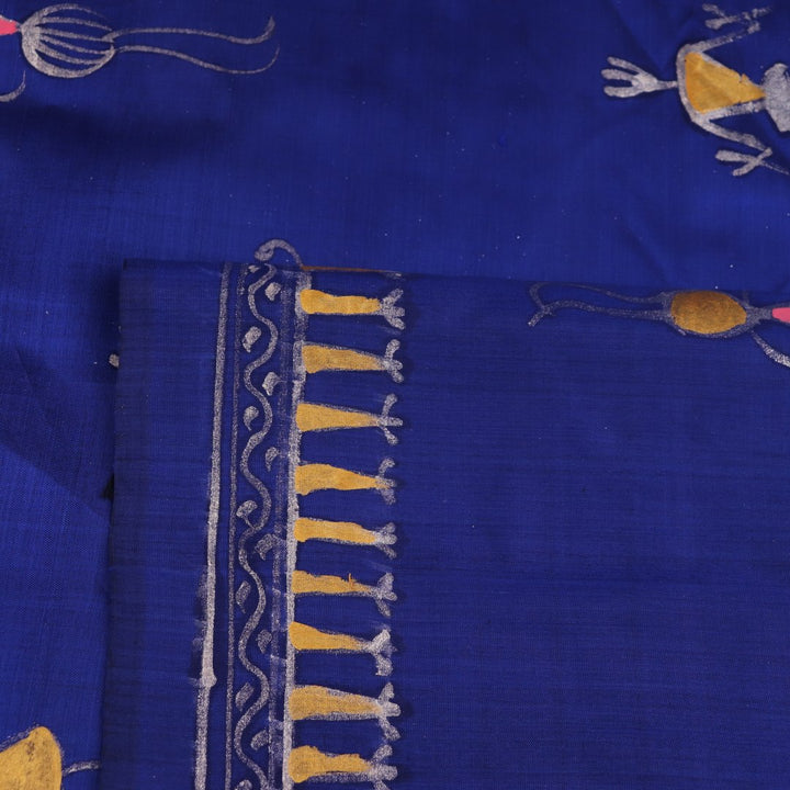 Close-up of handloom blue silk Patachitra saree, showcasing the detailed texture of the hand-painted fabric.