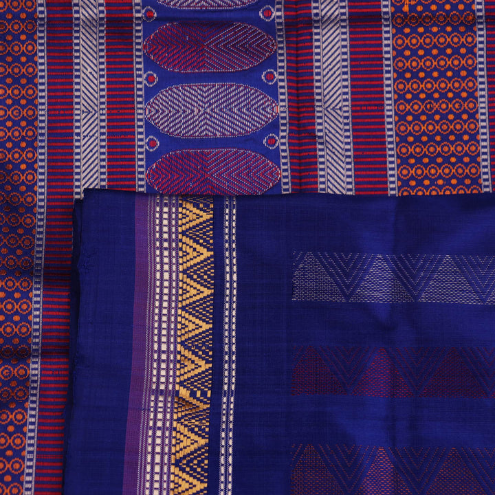 Close-up of pink and blue Dongria Silk Saree fabric texture with butta pattern.